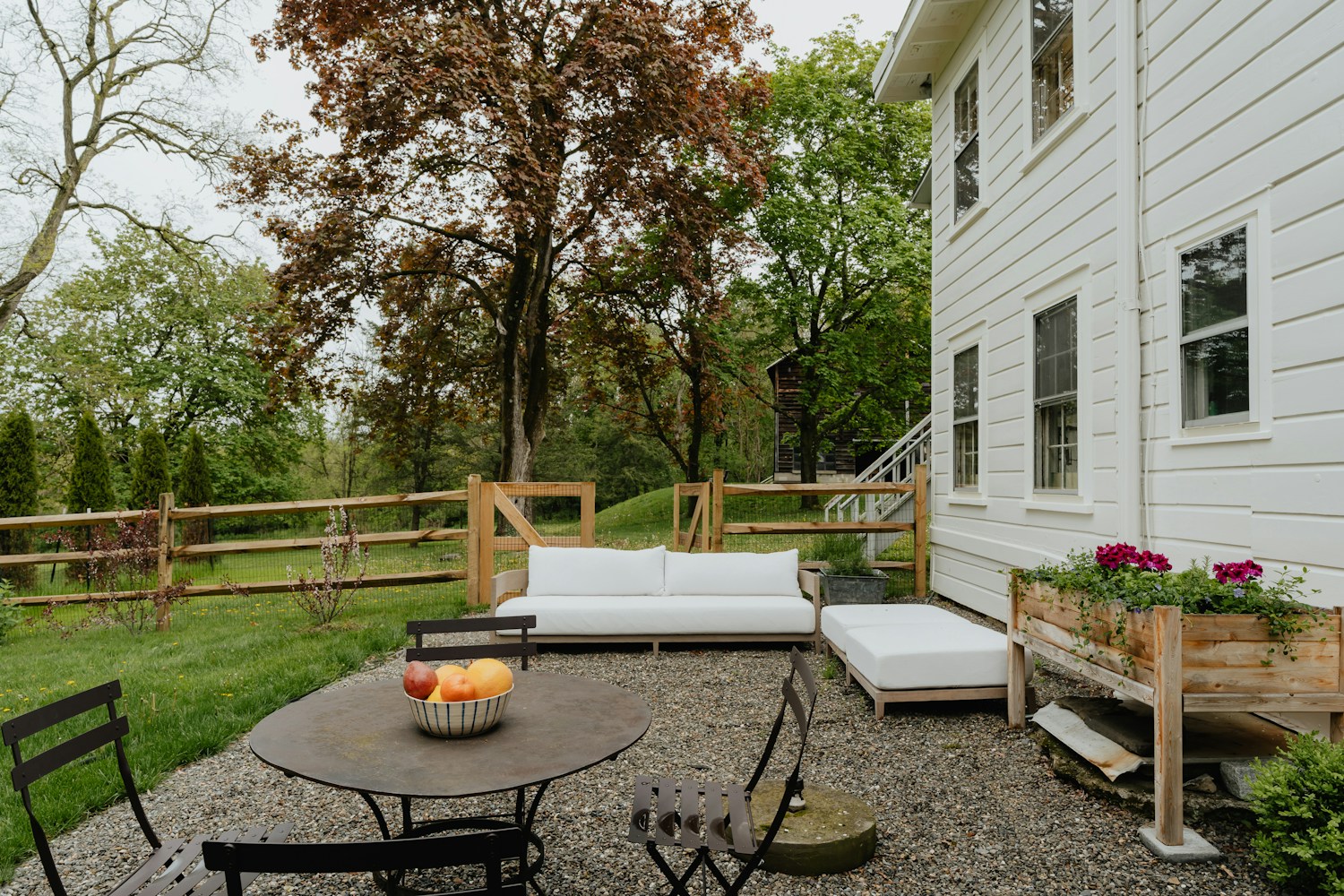 A garden terrace connecting comfortable outdoor seating with the landscape